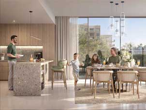 Family sharing a meal in their Ghaf Woods residence in Dubai, with views of the surrounding greenery.
