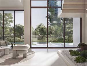 Modern Ora Bayn townhome interior in Ghantoot with a spacious living room, large windows, and outdoor views