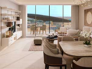 A modern living and dining area in Sidr Residences, showcasing the contemporary design and balcony access.