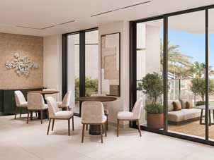A flexible multipurpose area in Sidr Residences, suitable for dining and gathering, with access to an outdoor terrace.