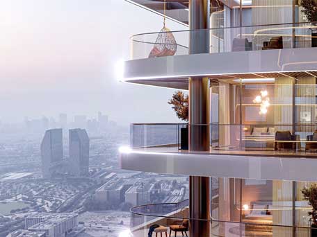 Exterior view of Skyhills Astra by HRE Development, showcasing a modern high-rise with curved balconies, a hanging egg chair, and a city skyline in the background at dusk.
