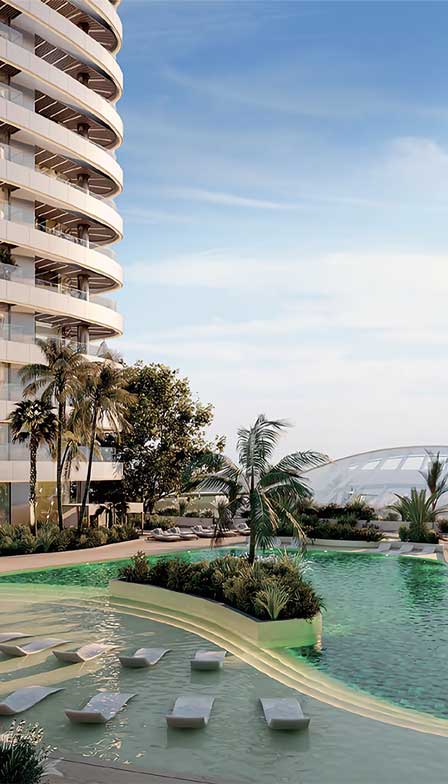 Luxury pool view at SkyHills Astra in Dubai Science Park with modern towers and palm trees.
