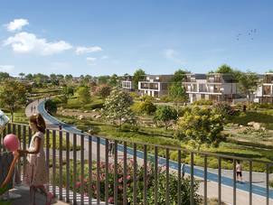 The active lifestyle at Riviera, The Valley by Emaar, with people walking and enjoying the community's outdoor amenities.